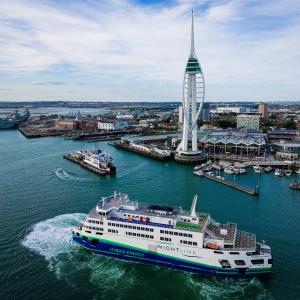 A Hybrid Whitelink Ferry, Victoria of Wight turns in front of the Spinnaker Tower in Portsmouth